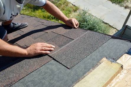 roofing team on shingles